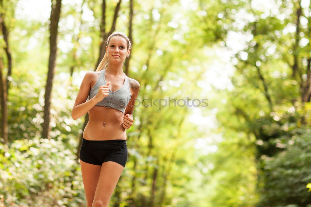 Similar – Young sporty woman jogging