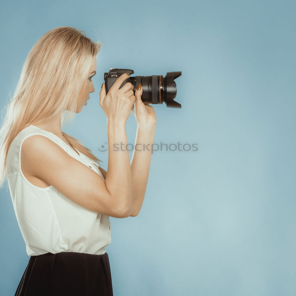 Similar – Cropped woman with vintage old camera