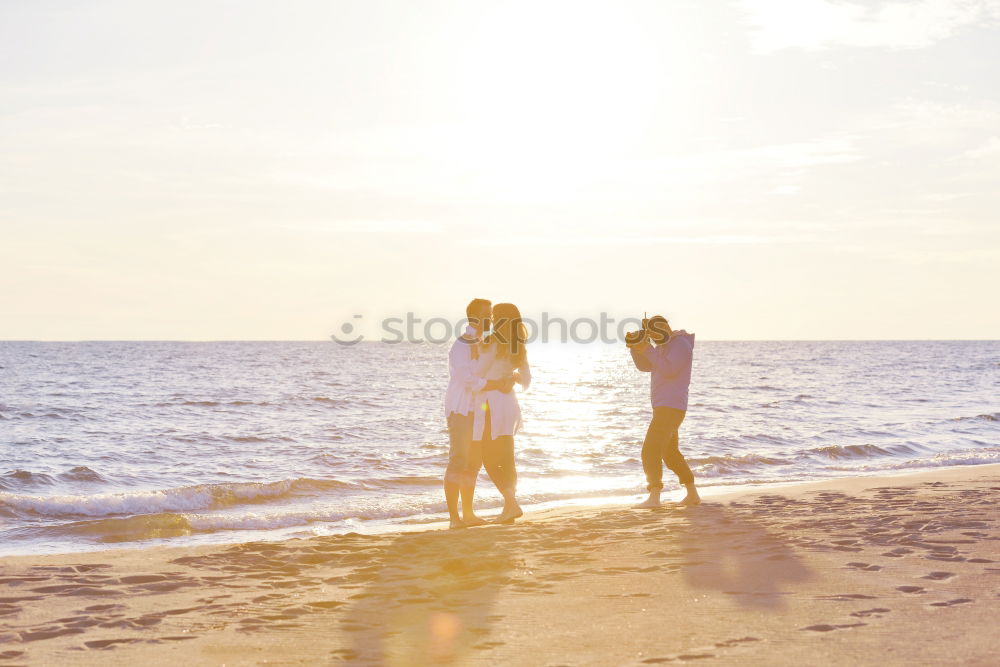 Similar – Father and son playing on the beach at the sunset time. Concept of friendly family.