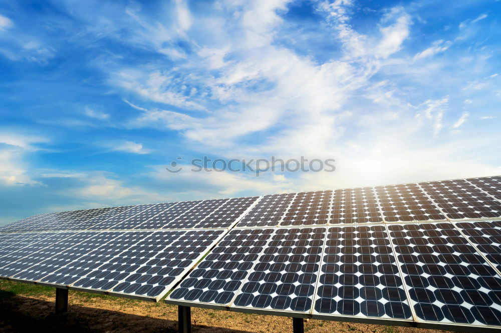 Similar – Image, Stock Photo An area of many photovoltaic panels. Solar power plant on an industrial roof , many solar panels , photovoltaics