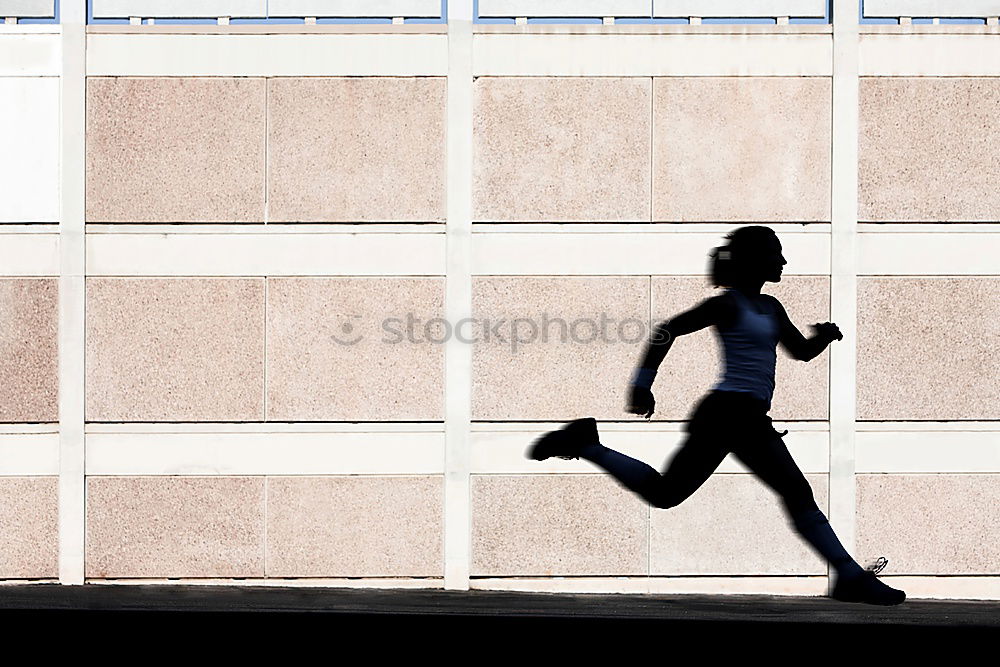 Image, Stock Photo Young fit blonde woman jumping in the street