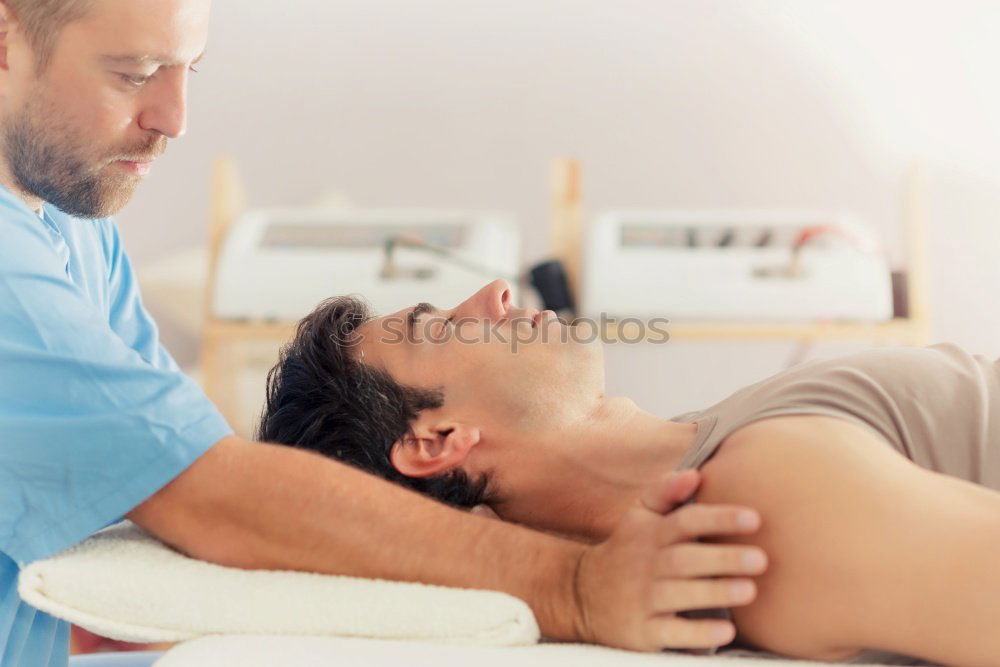 Similar – Image, Stock Photo young man at the physio therapy with pain