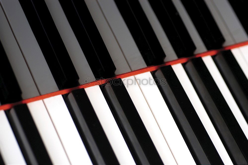 Similar – Illuminated grand piano by Steinway & Sons at concert in the evening