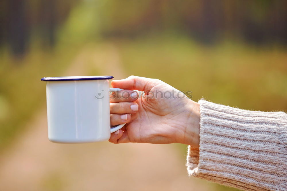 Similar – Image, Stock Photo Turquoise coffee mug held by hands of young woman in yellow pigtail sweater