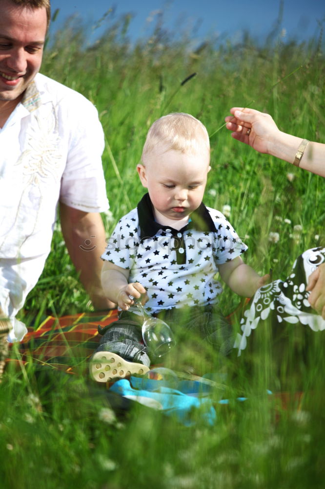 Similar – Granny sitting with her grandson on a meadow in nature