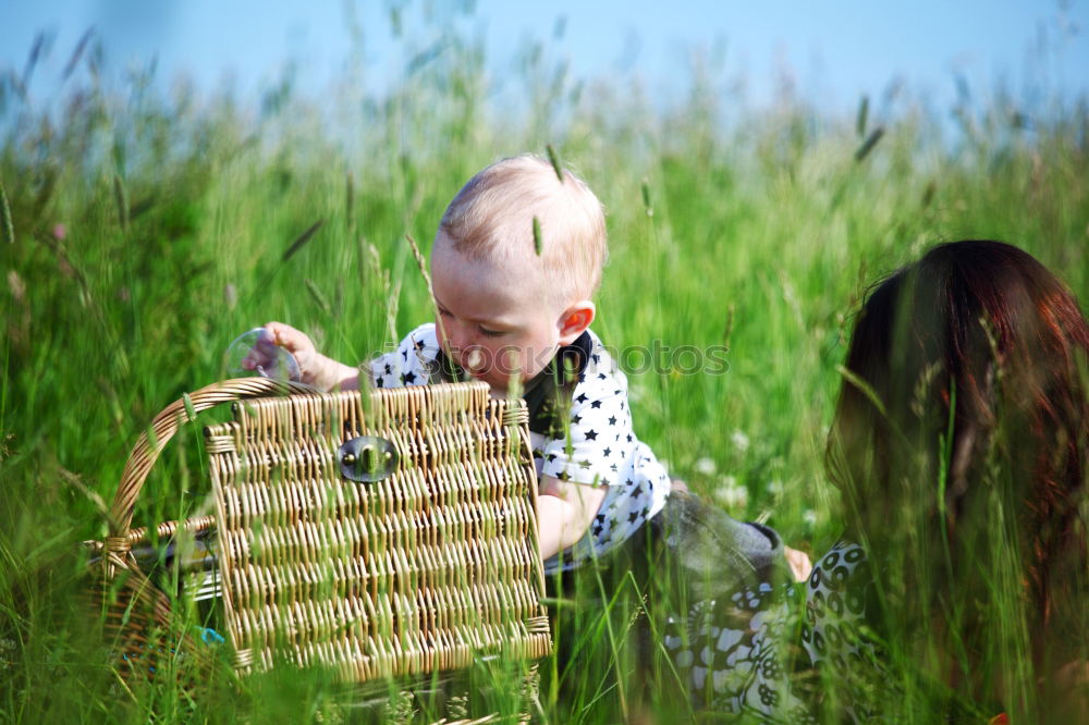 Similar – Image, Stock Photo Boy and girl picking up garbage from ground