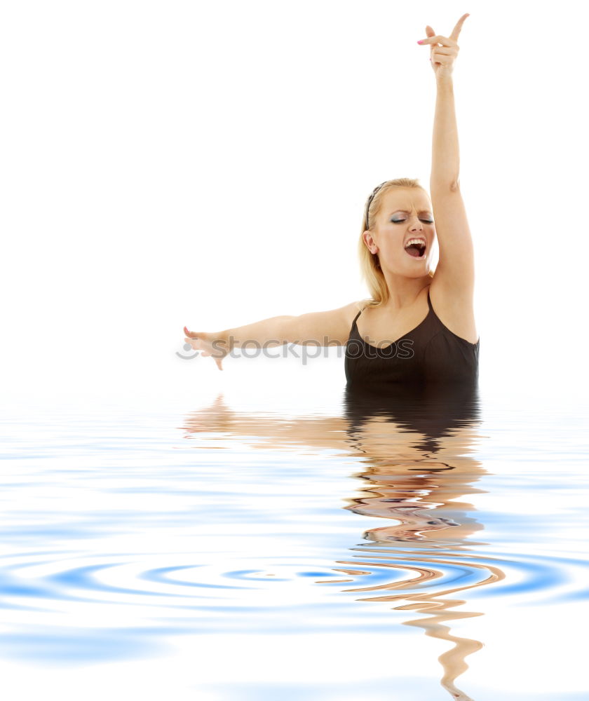 Similar – Mature brunette woman sunbathing by the pool with her feet in the water and a wrap around her body