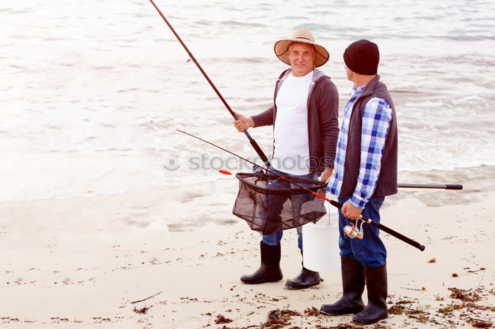 Similar – Image, Stock Photo Father and son playing on the beach at the day time. They are dressed in sailor’s vests and pirate costumes. Concept of happy game on vacation and friendly family.