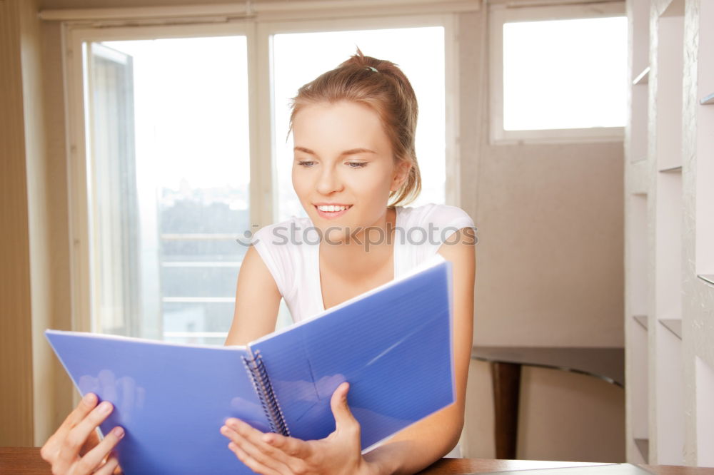 Similar – Image, Stock Photo Young woman in an apron looking up a recipe