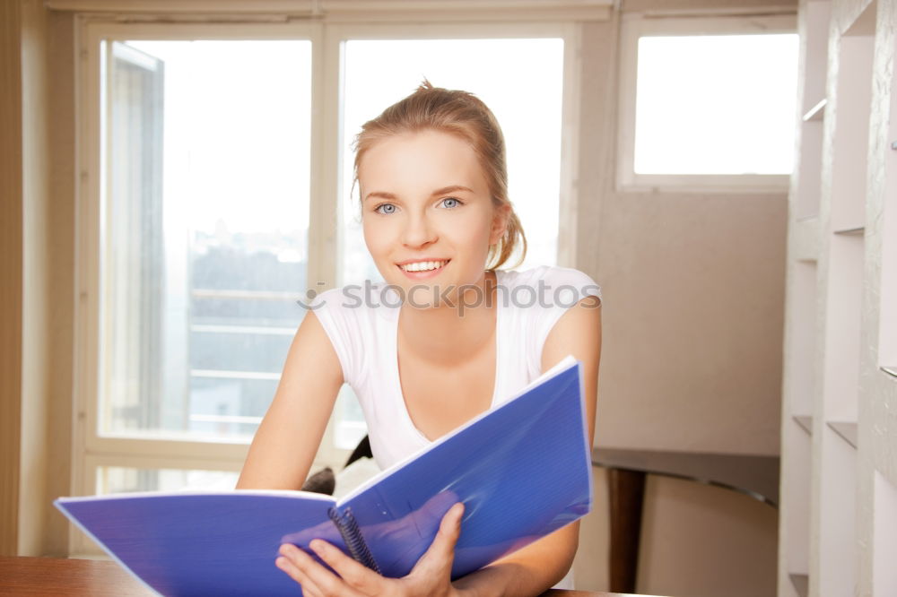 Similar – Image, Stock Photo Young woman in an apron looking up a recipe