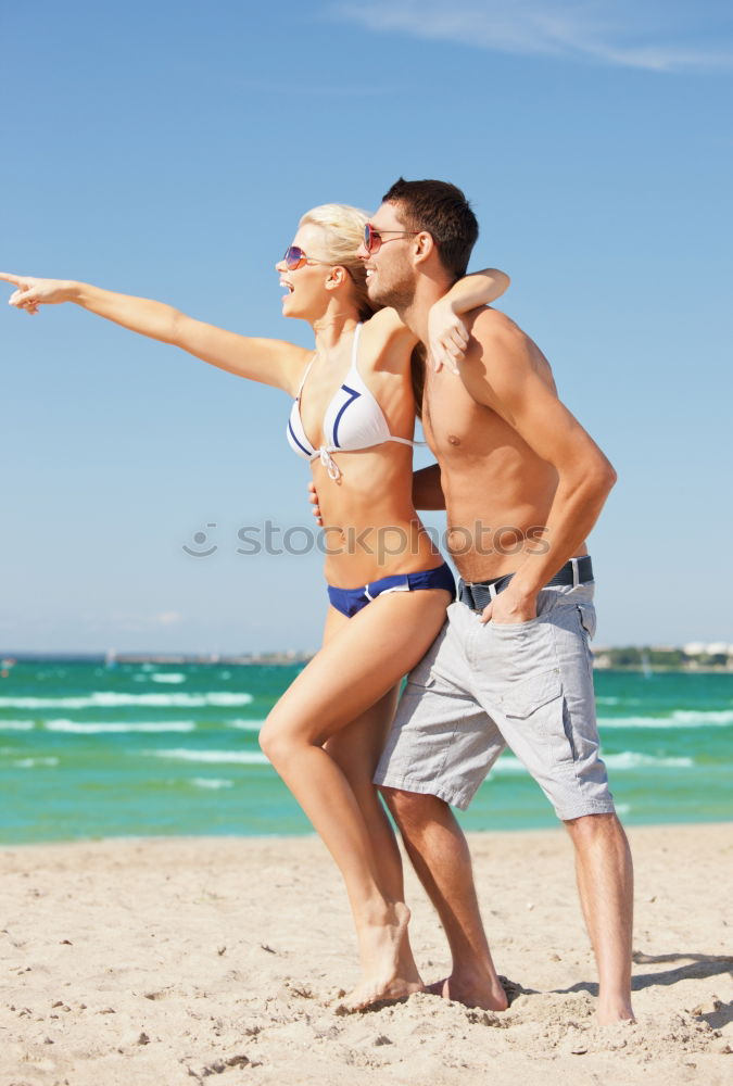 Similar – Close-up of young adult’s muscular bodies on the beach