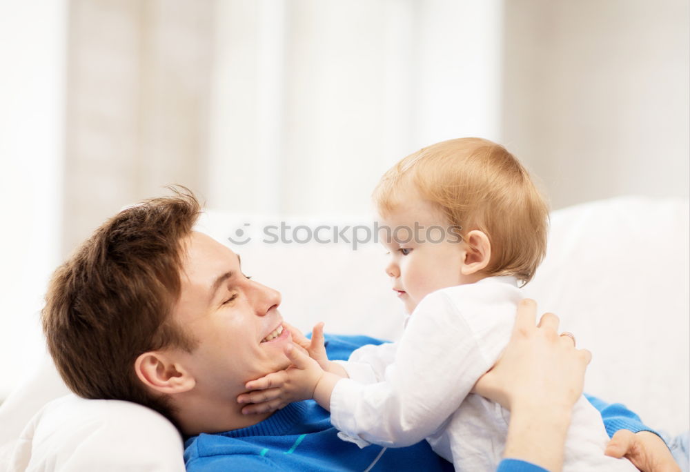 Happy Family, Mother, Father And Baby.