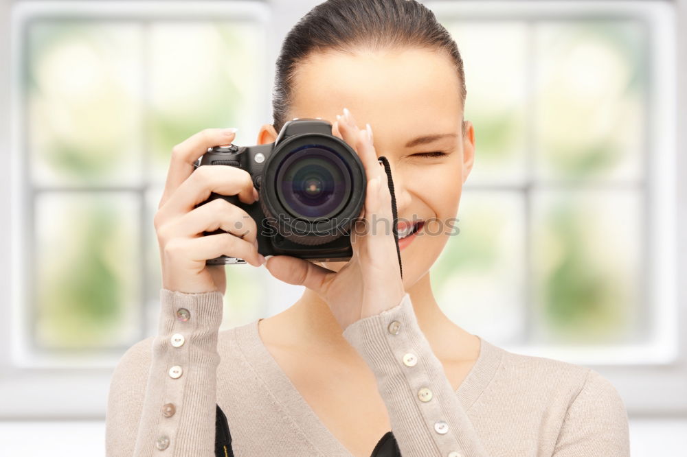 Similar – Image, Stock Photo Young woman using a camera to take photo.