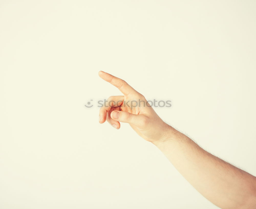 Similar – Image, Stock Photo Forearm and hand with spread fingers against a yellow background