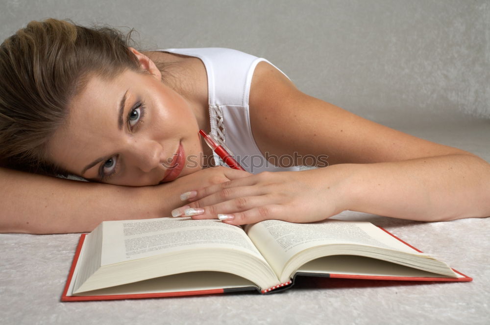 Similar – Image, Stock Photo Young woman on a train writing notes in a diary or journal staring thoughtfully out of the window with her pen to her lips as she thinks of what to write.