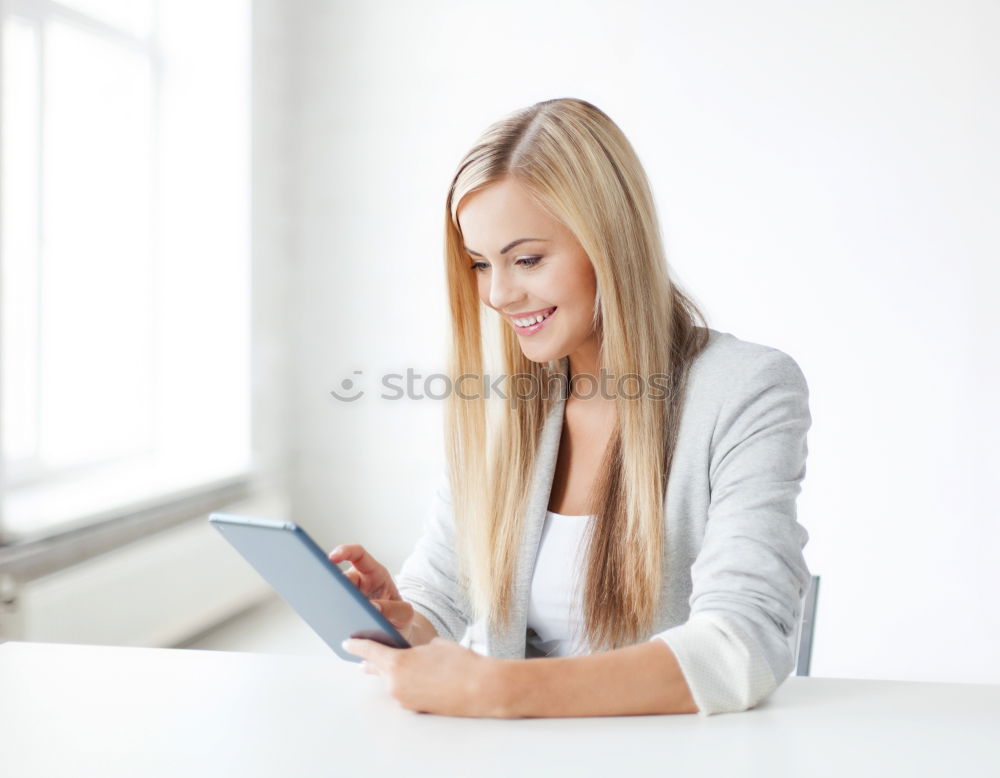 Similar – Young asian woman smiling and using tablet