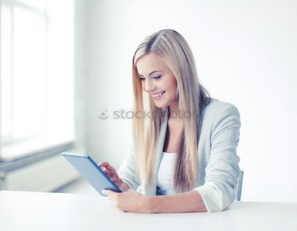 Similar – Young asian woman smiling and using tablet