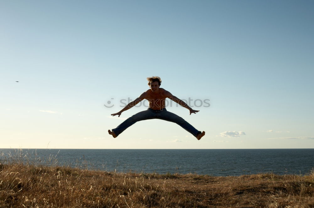 Similar – Backpacker jumping on landscape