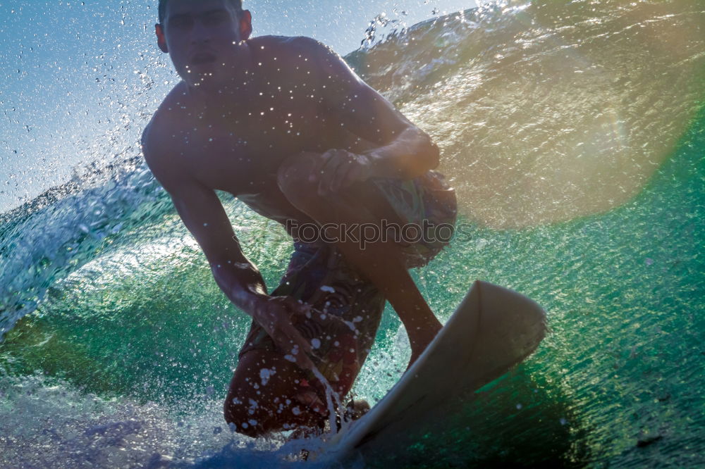 Similar – A young boy learning in body board outdoors in the shoreline in a sunny day of summer