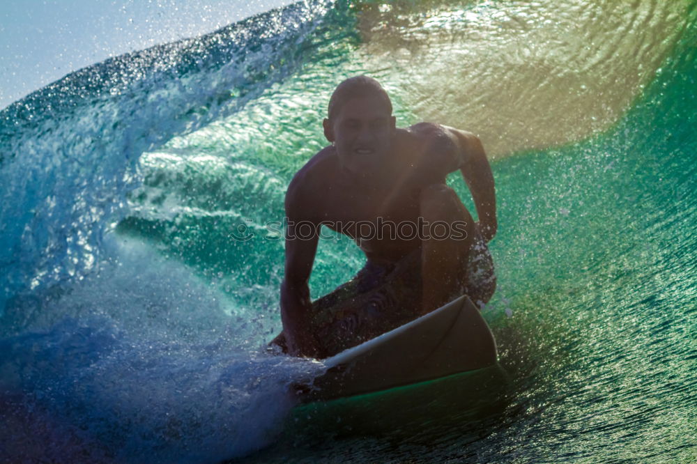 Similar – A young boy learning in body board outdoors in the shoreline in a sunny day of summer