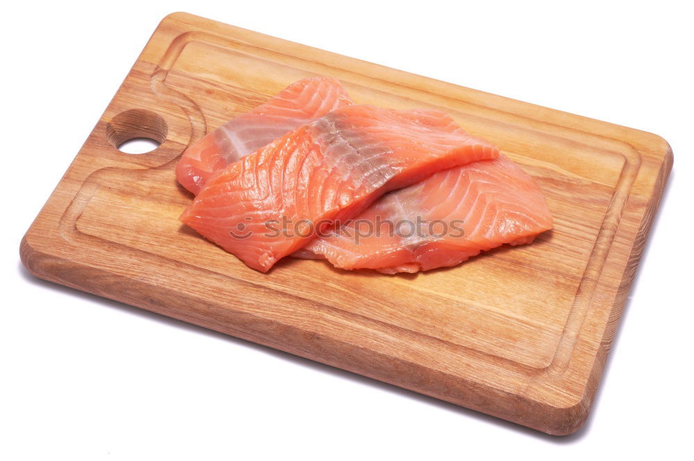 Similar – Fresh raw salmon on a wooden cutting board