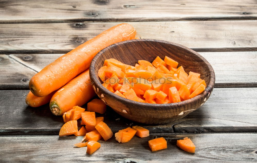 Similar – Two large ripe carrots lie in female hands