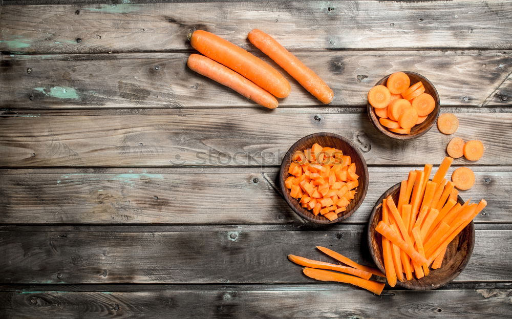 Similar – Two large ripe carrots lie in female hands