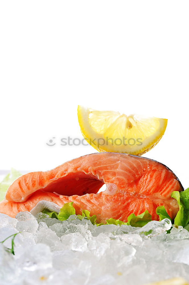 Similar – Raw salmon fillet with green herbs and lemon