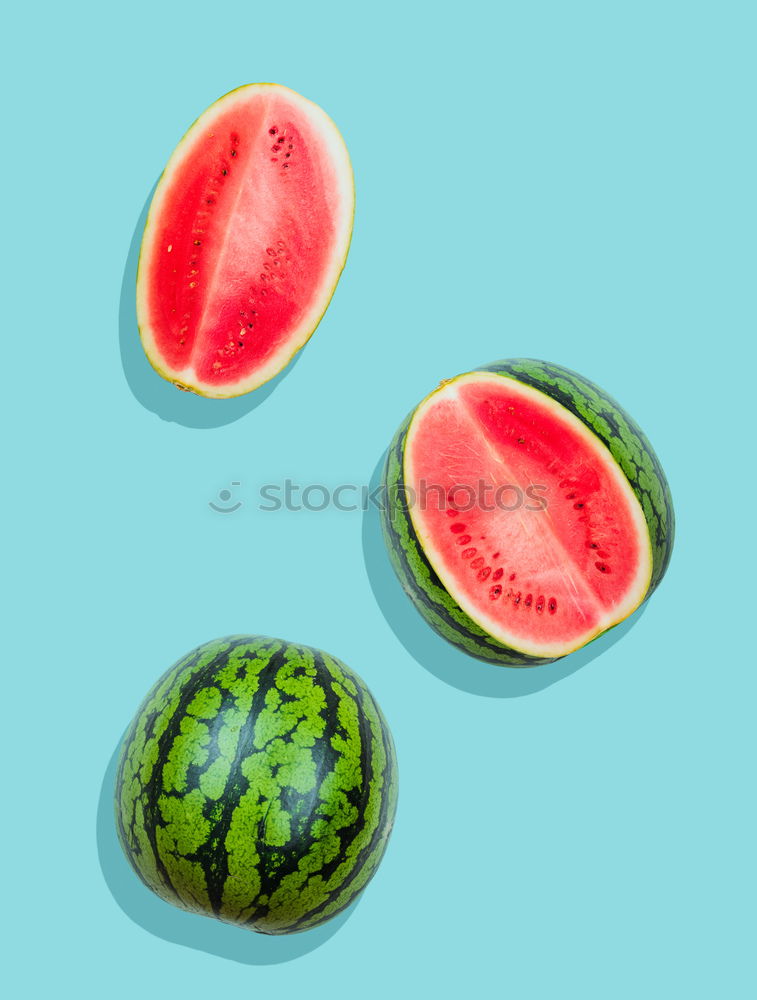 Pieces of watermelon on background painted in blue