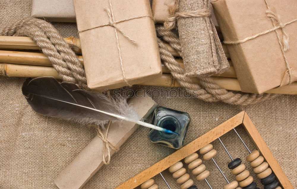 Similar – Pliers and twine on a plank