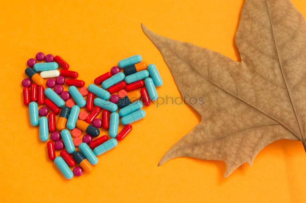 Similar – Image, Stock Photo Pills arranged in heart shape on an orange background