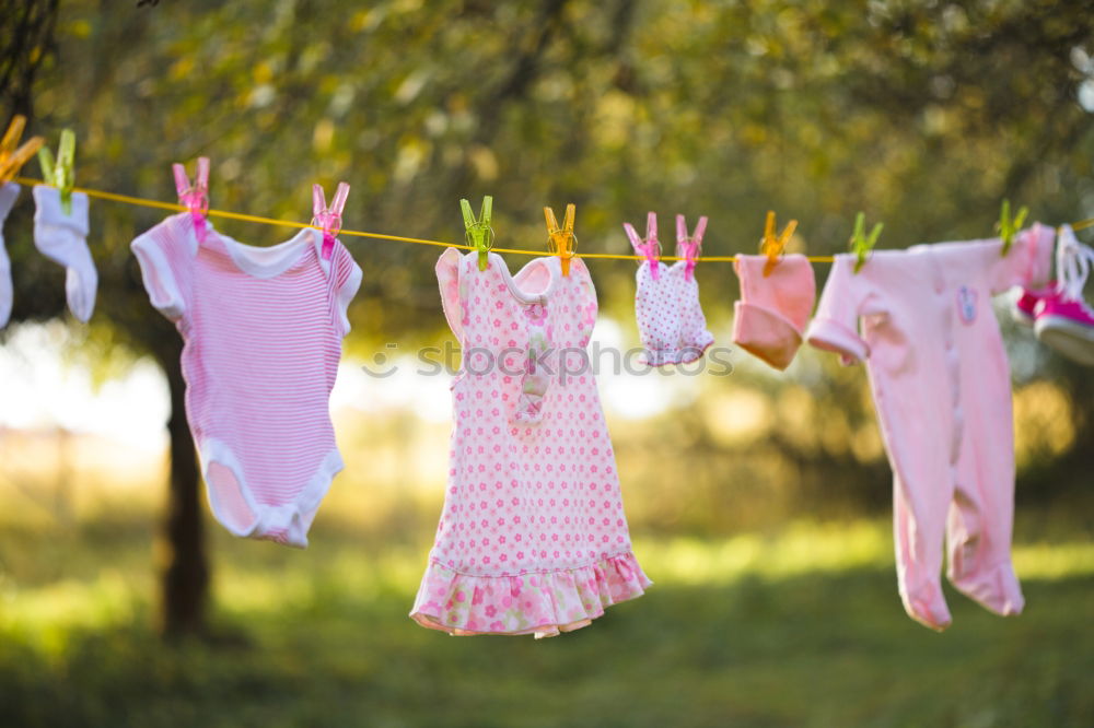 Similar – Baby bibs on laundry