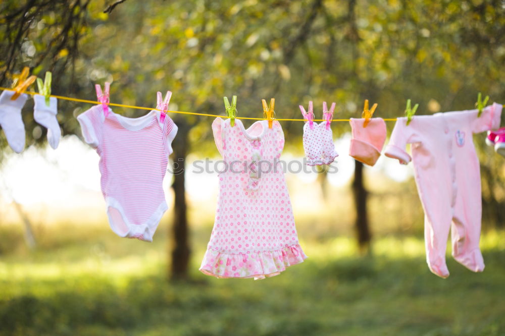 Similar – Baby bibs on laundry