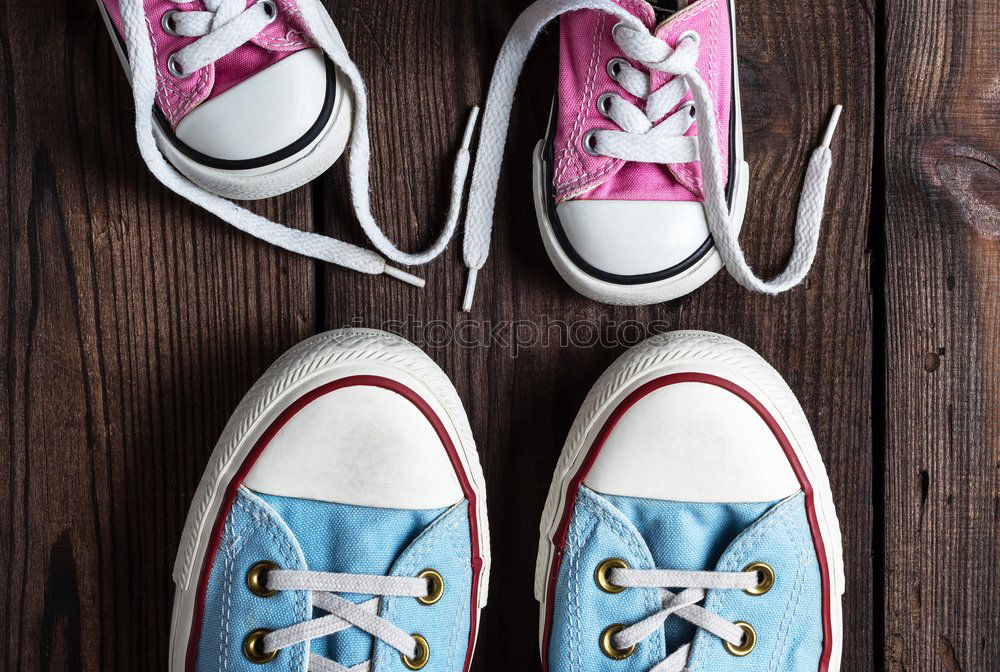 Similar – Image, Stock Photo Red shoes and red boxing gloves hanging on a rope