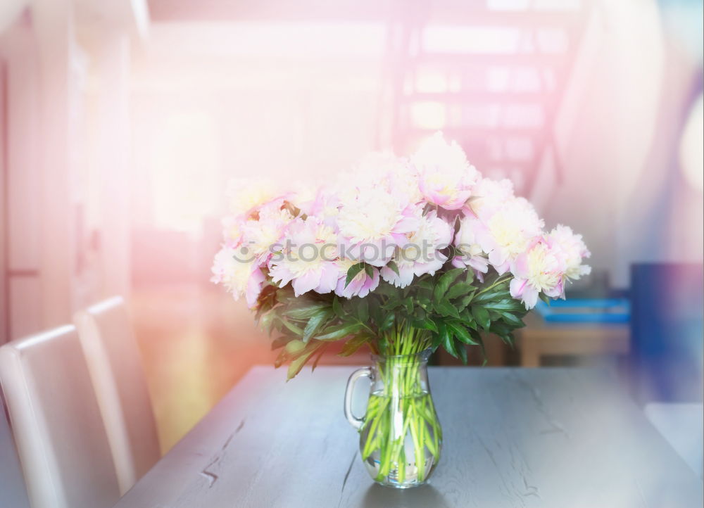 Peonies bouquet on table in living room