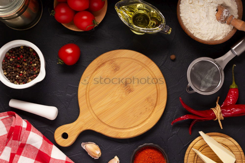 Similar – Image, Stock Photo cutting board with a knife and fresh red cherry tomatoes