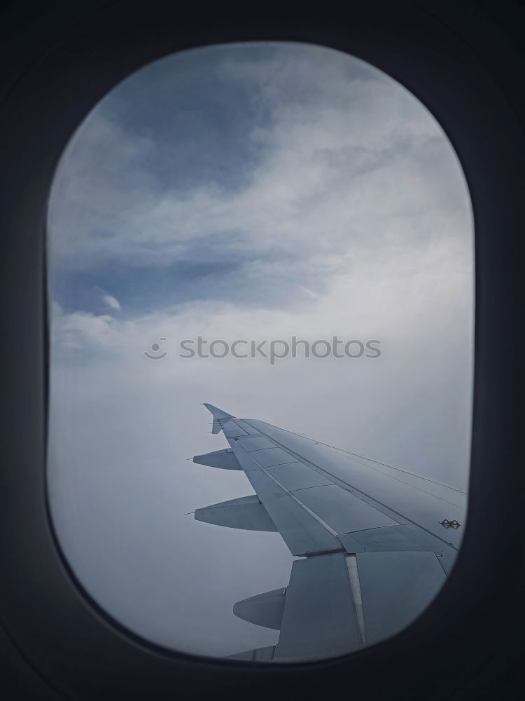 Similar – Foto Bild Über den Wolken Flugzeug