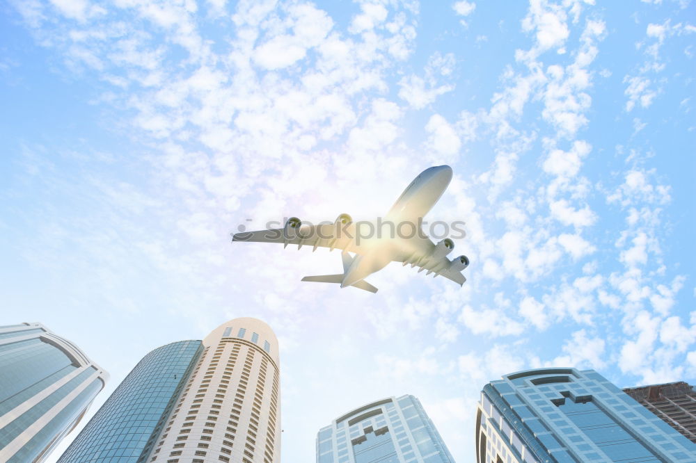 Plane flying over building