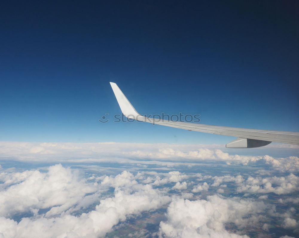 Similar – Above the clouds* Airplane