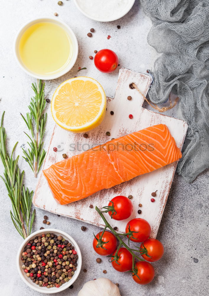 Similar – Salmon with spinach on a white kitchen table