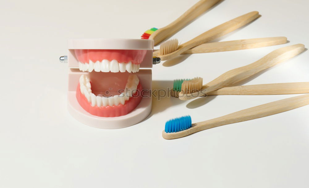 Similar – Image, Stock Photo A set of dentures lies ready on the bedside table together with a 60s alarm clock. Vintage. Seniors, dentures