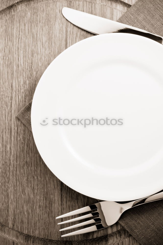 Similar – Image, Stock Photo The letters HUNGER on a plate with knife and fork and napkin and a glass of water