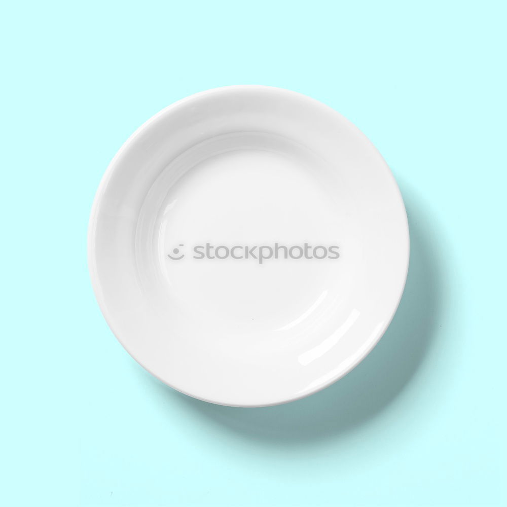 Similar – Empty plate on blue wood background