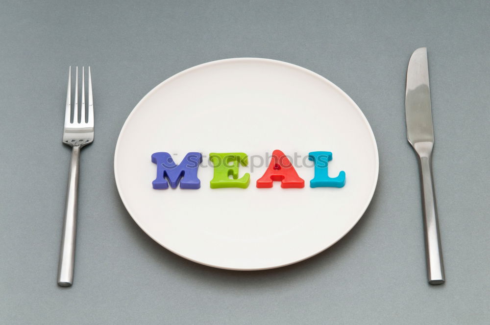 Image, Stock Photo The letters HUNGER on a plate with knife and fork and napkin and a glass of water