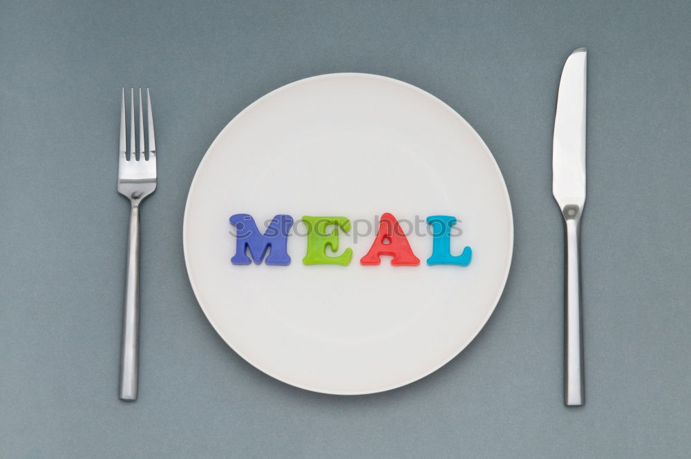 Similar – Image, Stock Photo The letters HUNGER on a plate with knife and fork and napkin and a glass of water