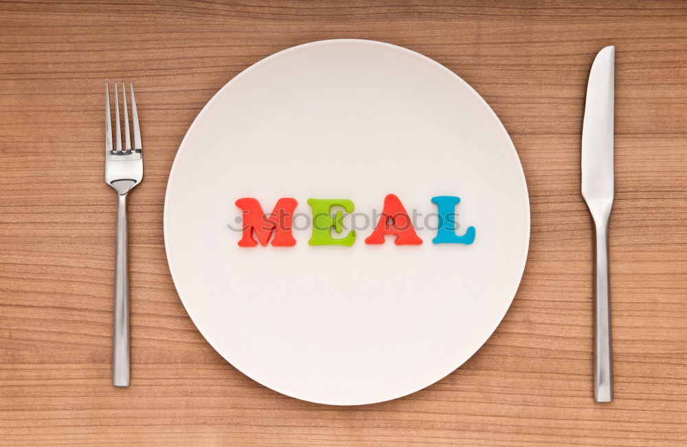 Similar – Image, Stock Photo The letters HUNGER on a plate with knife and fork and napkin and a glass of water