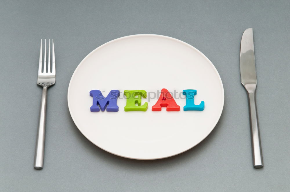 Similar – Image, Stock Photo The letters HUNGER on a plate with knife and fork and napkin and a glass of water