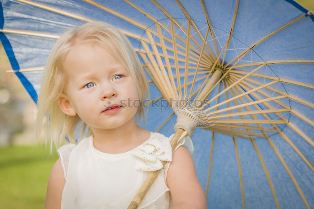 Similar – Kid girl playing with garden sprinkler