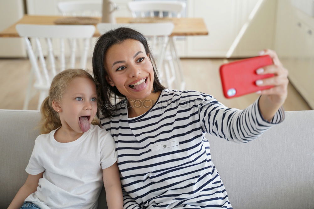 Similar – happy mother and toddler son using tablet