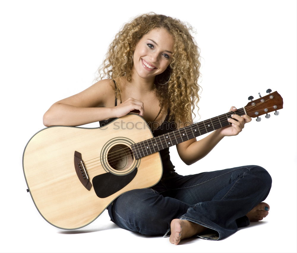 Beautiful woman playing guitar.